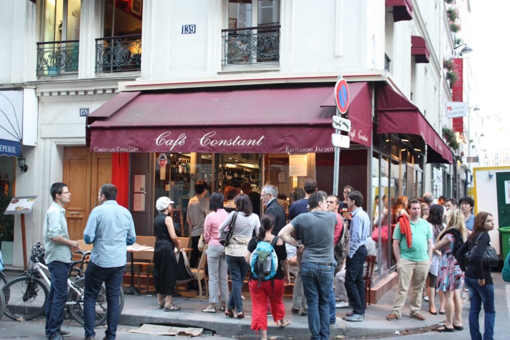 people in front of Café Constant